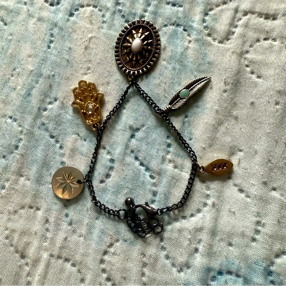 Elegant Multi-Charm Bracelet in Black and Gold
